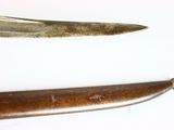 two old knives on a white surface next to each other
