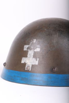 a close up of a helmet with a cross on it