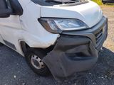 a white van that is sitting in the dirt