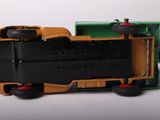 a toy truck that is sitting on a white surface