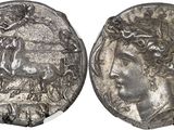 a silver coin with an image of a woman and a man on it