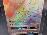 a pokemon card in a clear box on a table