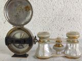 three salt and pepper shakers and a clock on a table