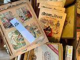 a box full of old books on the floor