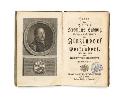 an old book with a picture of a man in a suit and tie