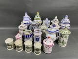 many different types of coffee cups and mugs on the table