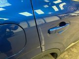 a close up of a car door handle with a sticker on it