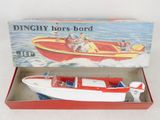 a box with a toy boat in it on a table