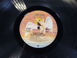 an image of a vinyl record with a picture of an angel on it