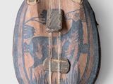 an old wooden bag with a design on it