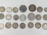 a lot of coins that are on the table
