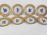six assiettes sur lesquelles figurent les portraits d'un homme et d'une femme