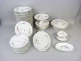 a lot of plates and bowls that are sitting on a table