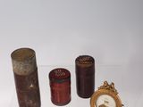 three different types of perfume bottles on display on a shelf