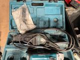 a blue tool box with tools in it on the floor