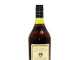 a bottle of whisky sitting on top of a white surface