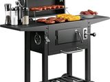an image of a barbecue grill with meats and vegetables on it