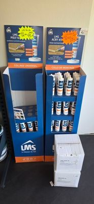two boxes of paint and a box of glue next to each other