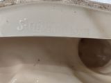 a close up view of a porcelain statue of a woman