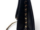 the black purse has a chain hanging from it ' s side
