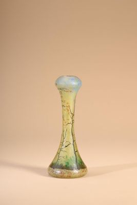 a glass vase that is sitting on a table