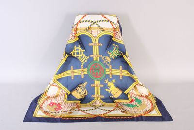 an image of a blue and yellow scarf with a cross on it