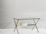 a white desk with a glass top and metal legs