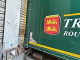 a truck that is parked in front of a building