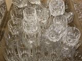 many empty glasses in a box on the table