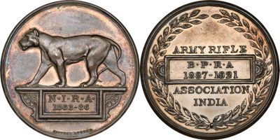 a close up of a coin with a dog on it
