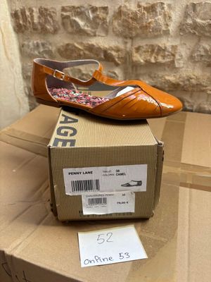a box that has a pair of shoes on top of it