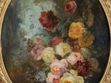 a painting of flowers in a gold frame on a blue wall