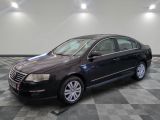 a picture of a black volkswagen passat parked on a checkered floor