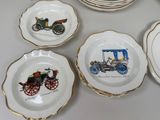 many plates with different designs on them on a table