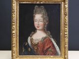 portrait of a lady in a red dress with a gold frame