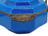 a small blue box with a handle on a white background