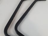 a pair of black bike handle bars sitting on top of a white table