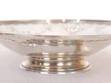 a silver bowl that is sitting on a table