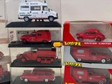 a lot of different model cars in a display case