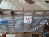 a large stack of boxes on a pallet in a warehouse