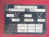 a close up of a sign on a red vehicle