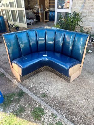 a blue bench made out of wooden pallets in a yard