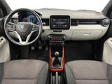the interior of a small car with a steering wheel and dashboard