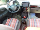 a picture of a car interior with a steering wheel and dashboard