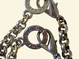 a metal chain with a lock and a key on it