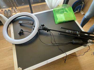 a table with a camera and a light on it