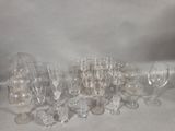 a lot of wine glasses and wine glasses on the table