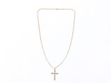 a close up of a necklace with a cross on it