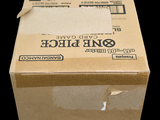 a cardboard box with a piece of paper on top of it