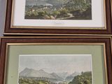 two framed prints of a view of a valley and mountains